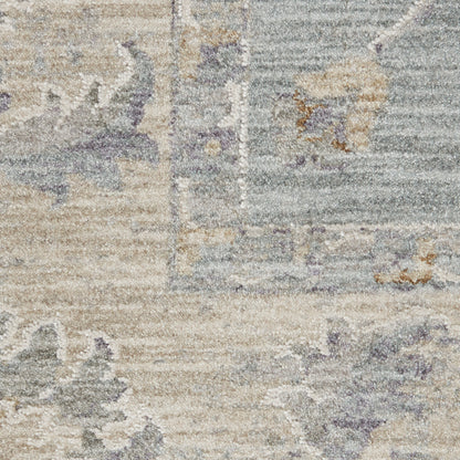 Muted beige & blue vintage-style rug with lavender accents, distressed floral pattern, low-pile.