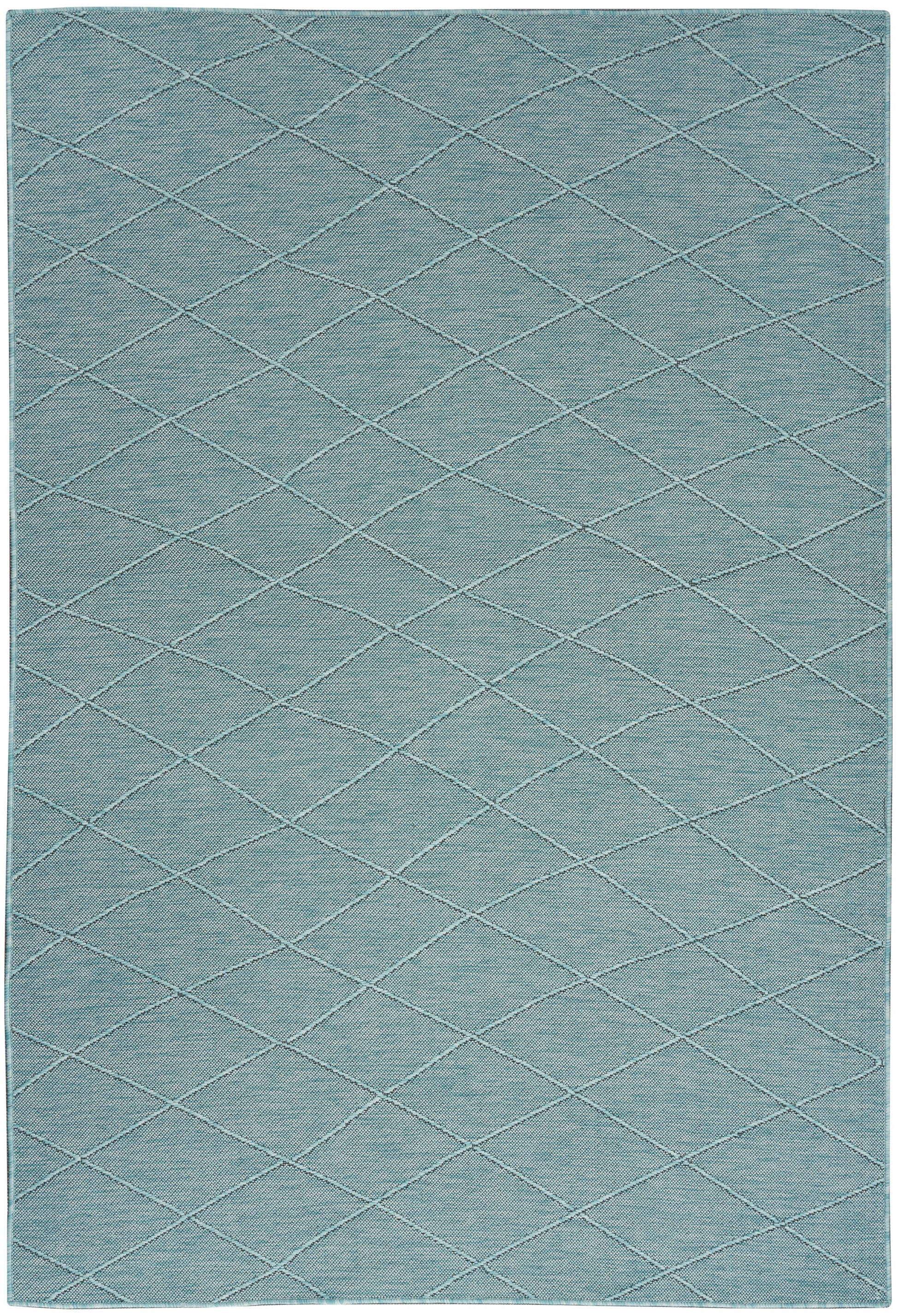 Blue diamond-quilted area rug with subtle stitched lines and soft texture.