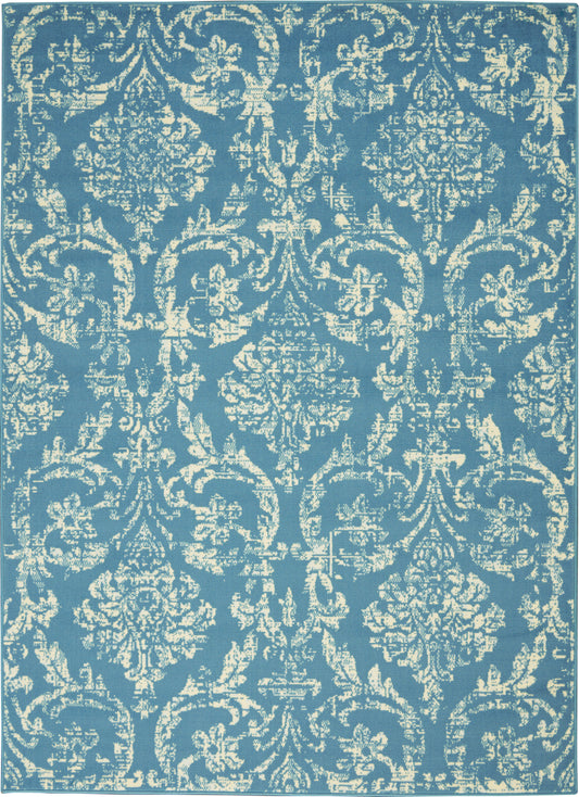 Rectangular blue rug with cream damask pattern and ornate scrolling floral medallions; traditional decor.