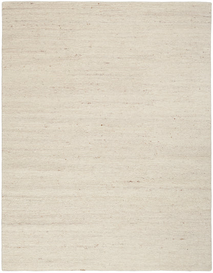 Beige woven flatweave rug with natural texture and tiny specks; rectangular area rug for living room.