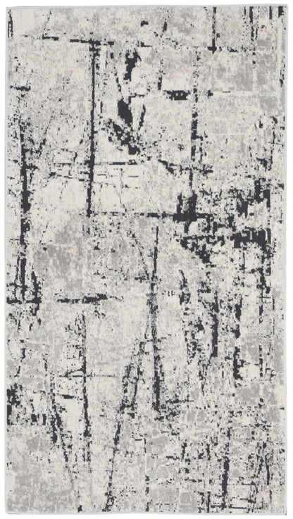 Rectangular gray and black abstract distressed rug, modern contemporary style for living room or hallway.