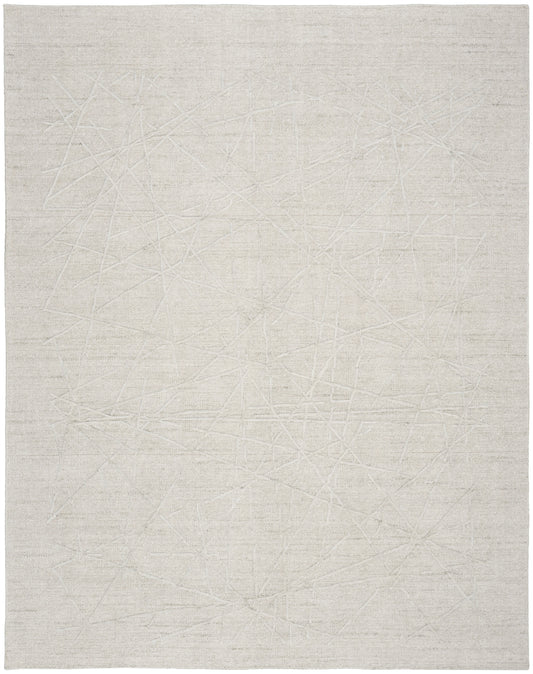 Cream-toned flat-weave rug with faint linear scratch-like pattern and soft woven texture.