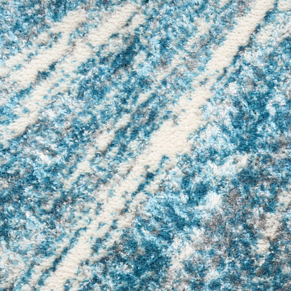 Blue and white textured rug with diagonal stripe pattern and plush pile.