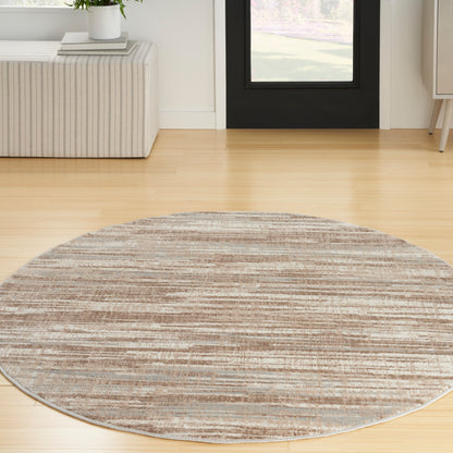 Round striped beige & brown area rug on light wood floor in modern living room