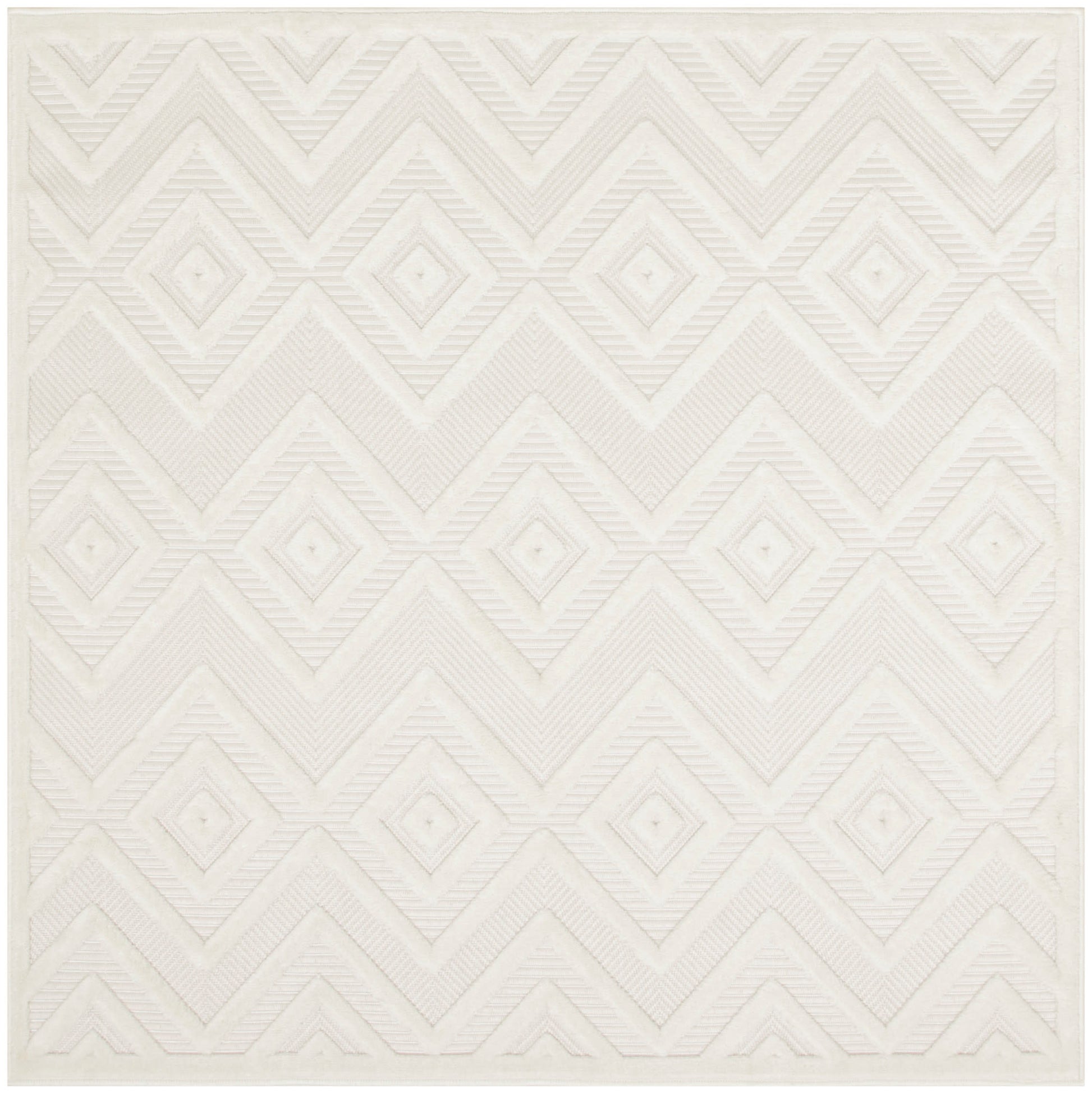 Cream square rug with raised diamond and chevron geometric pattern; soft textured surface.