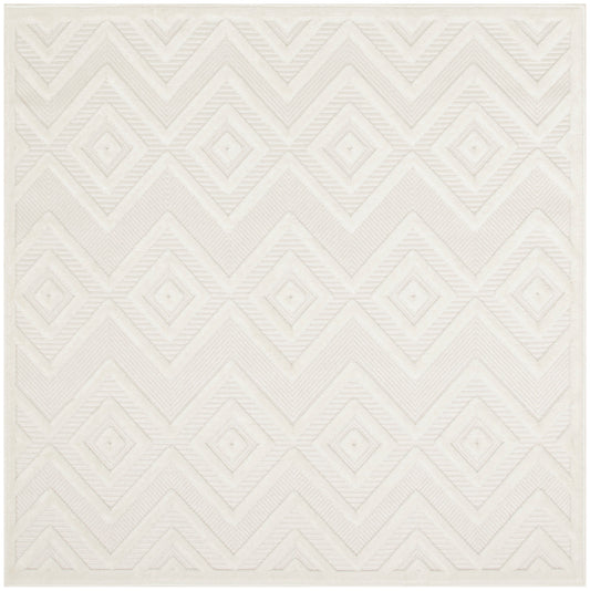 Cream square rug with raised diamond and chevron geometric pattern; soft textured surface.