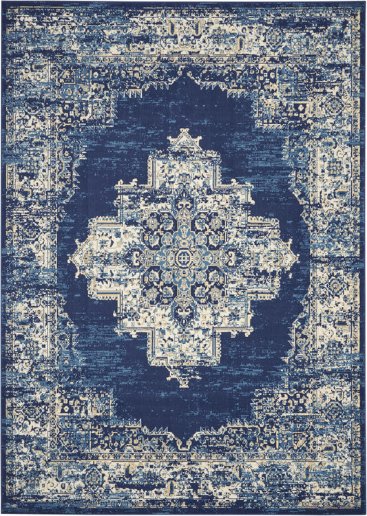 Distressed navy blue rug with ivory central medallion, intricate floral motifs & ornate border.