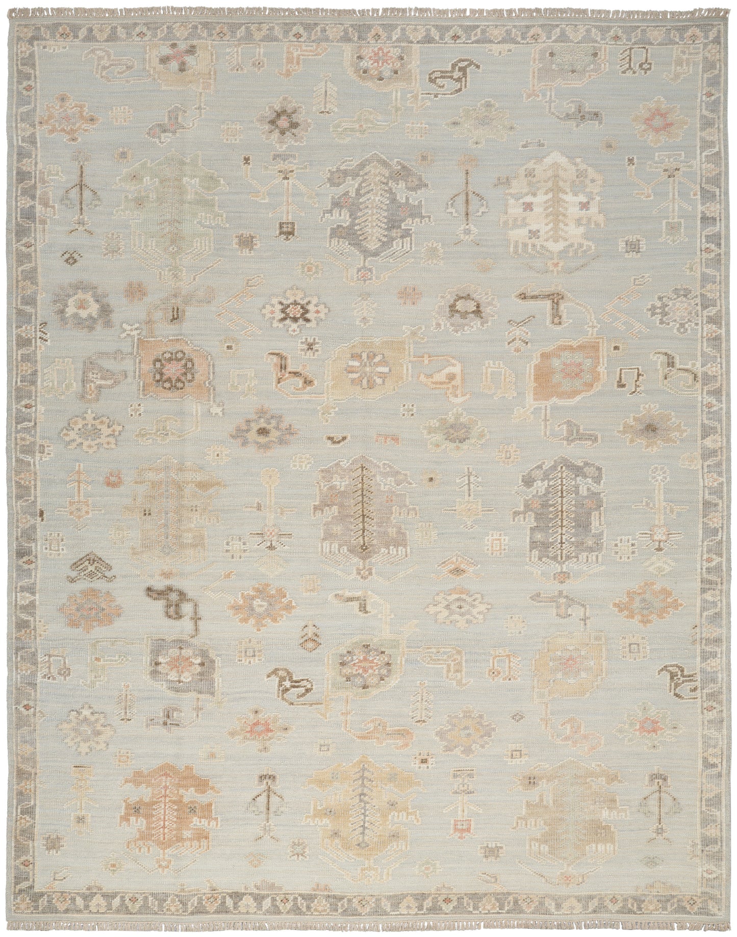 Pastel blue antique-style area rug featuring faded ivory, beige and peach geometric floral motifs and a decorative border.
