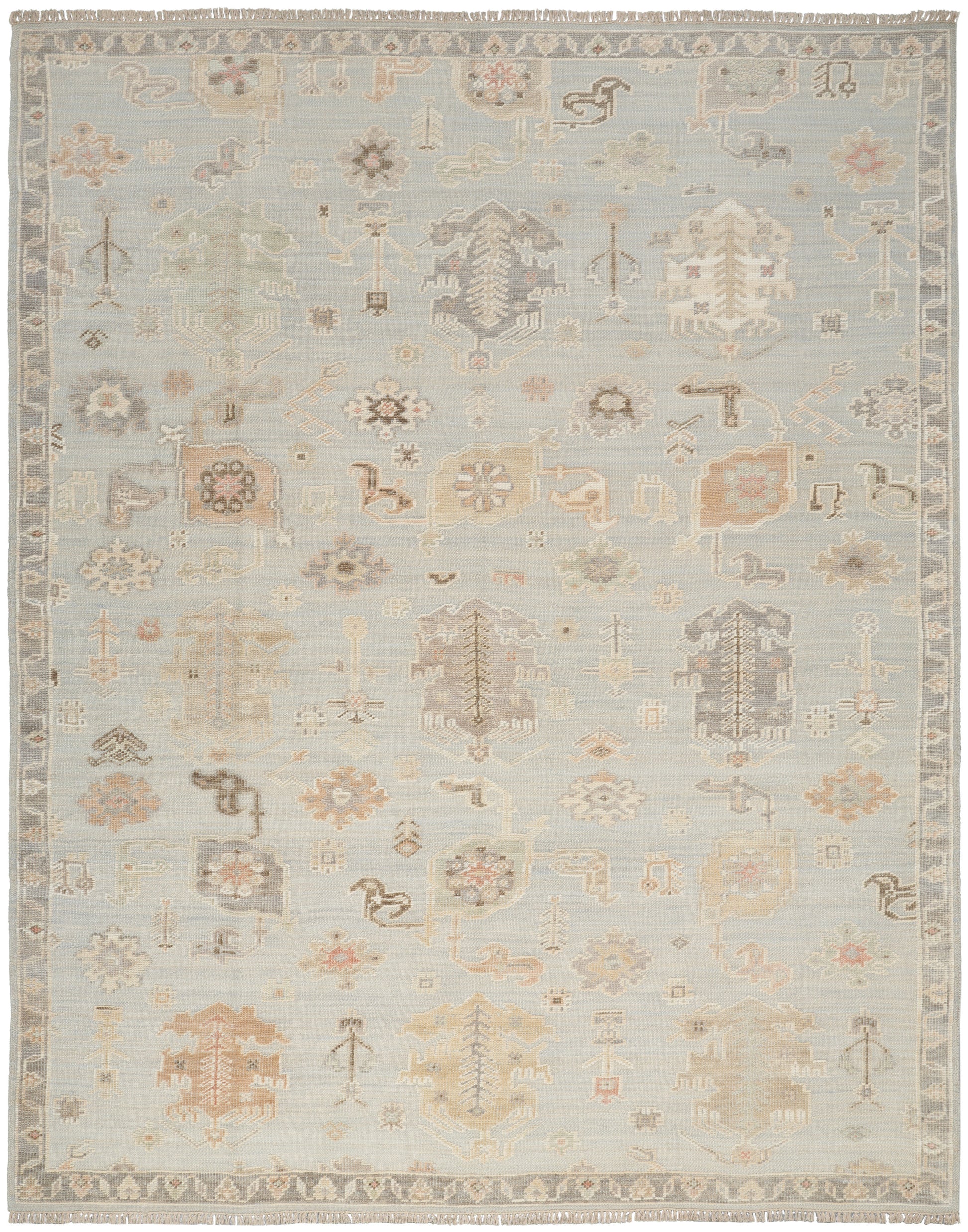 Pastel blue antique-style area rug featuring faded ivory, beige and peach geometric floral motifs and a decorative border.