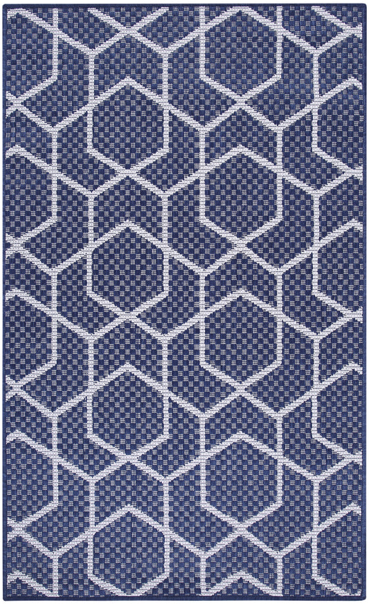 Navy blue rectangular rug with white geometric hex pattern; woven texture, modern floor decor.