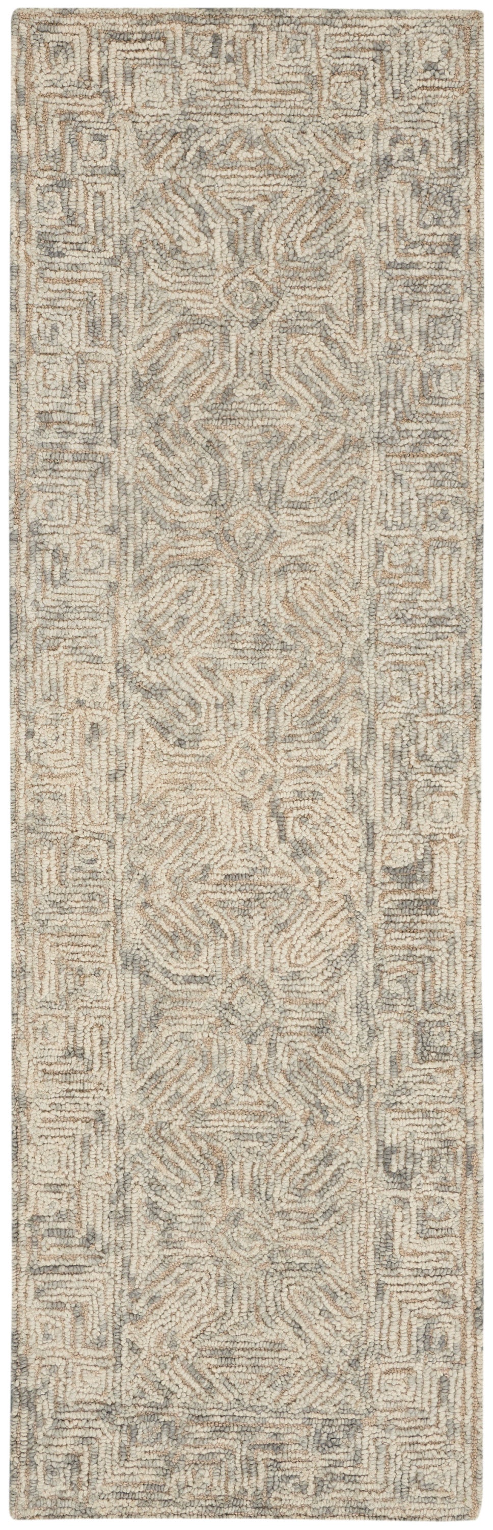 Soft tufted shag rug runner in ivory-beige-gray with a geometric center motif and intricate border.