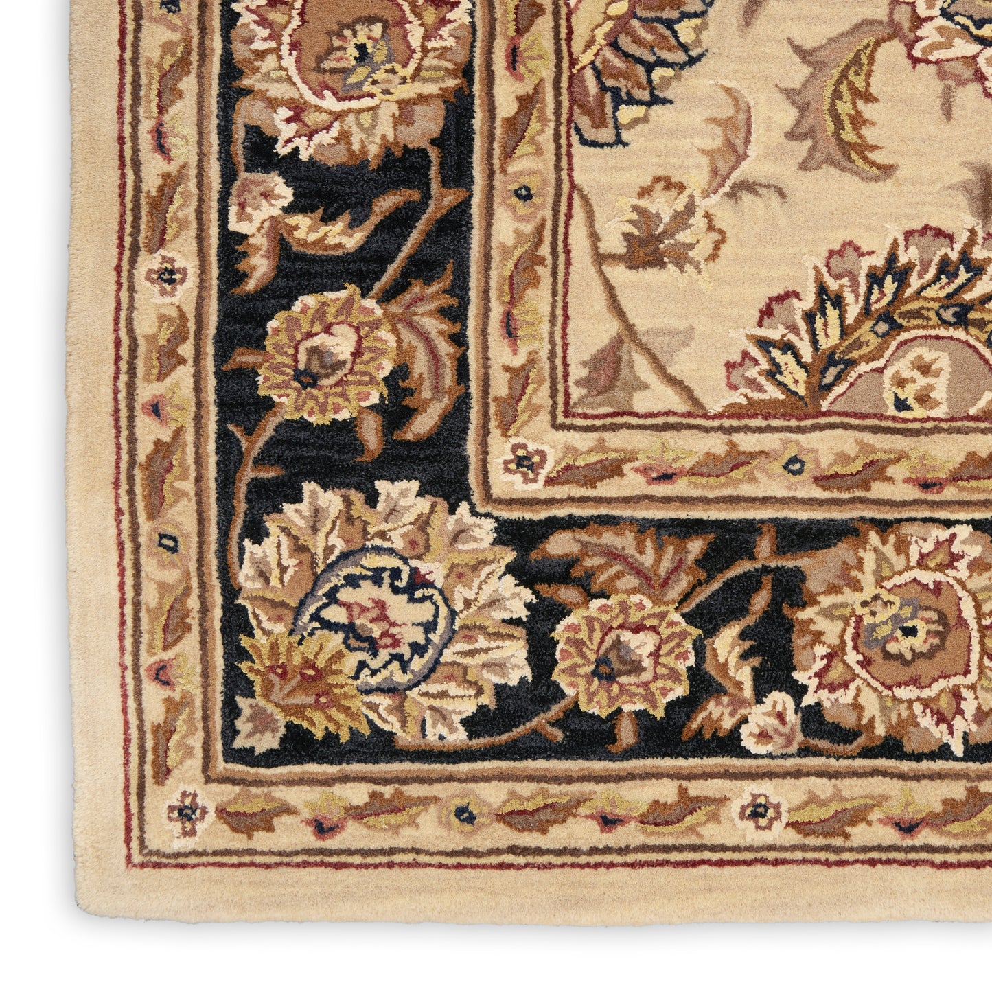 Corner view of a traditional Persian-style area rug with cream field, black border, and gold-red floral motifs.