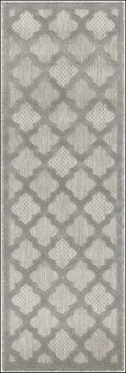 Gray toned outdoor runner rug with an interlocking diamond lattice pattern in beige and a soft fringe border.