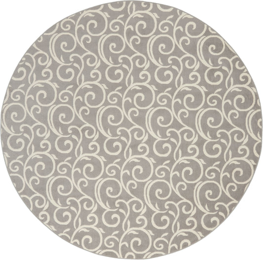 Round taupe rug with cream swirling scroll pattern; soft, durable decorative floor covering.