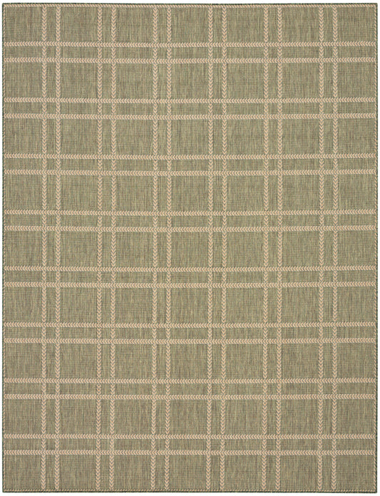 Rectangular woven rug with beige grid on olive backdrop; textured jute-like material; casual indoor decor.