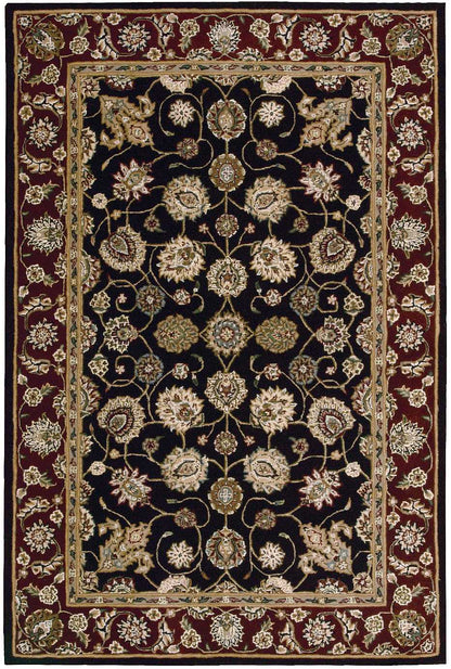 Decorative Persian-style oriental rug with black field, gold and cream floral motifs, and burgundy border.