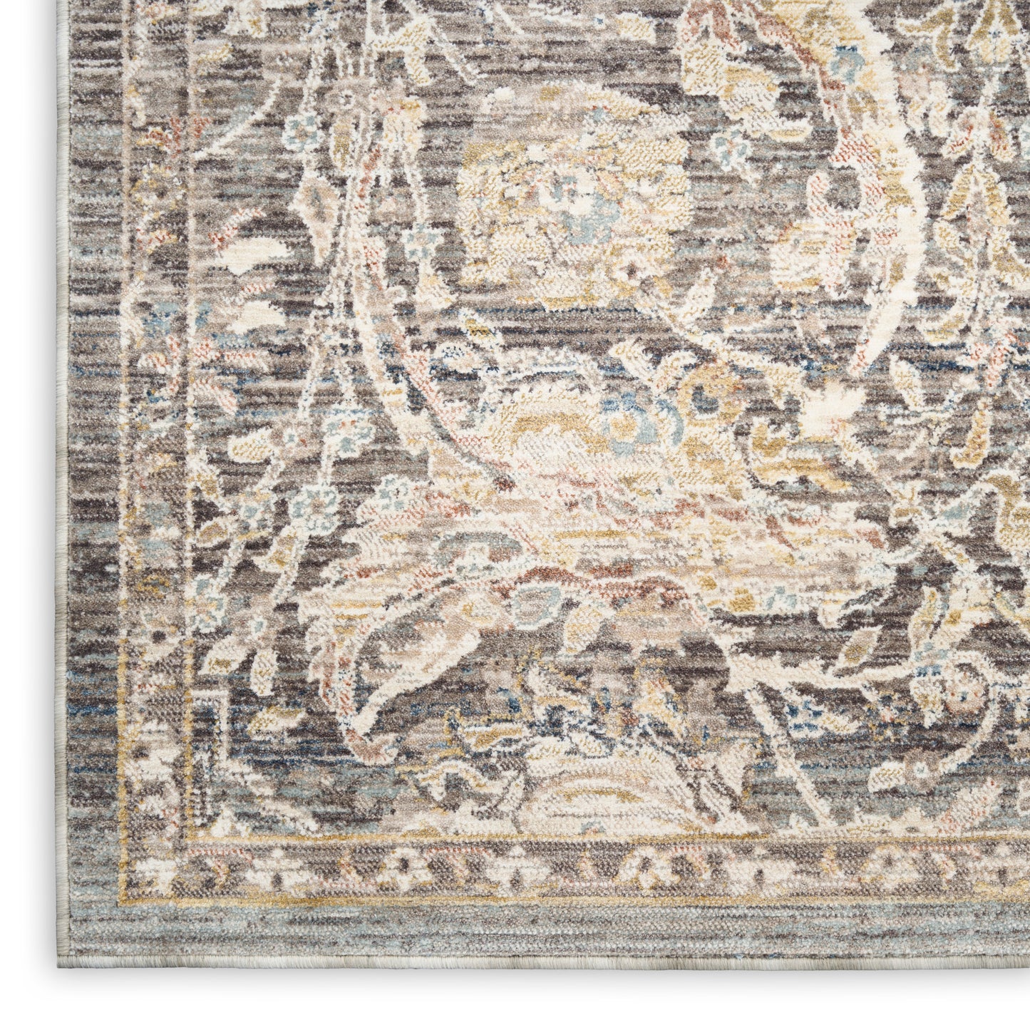 Taupe-gray oriental rug with ivory floral motifs, pale blue and gold accents, bordered edge in a traditional weave.