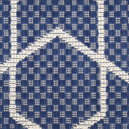 Blue and white woven fabric with a diamond lattice pattern and basket-weave texture.