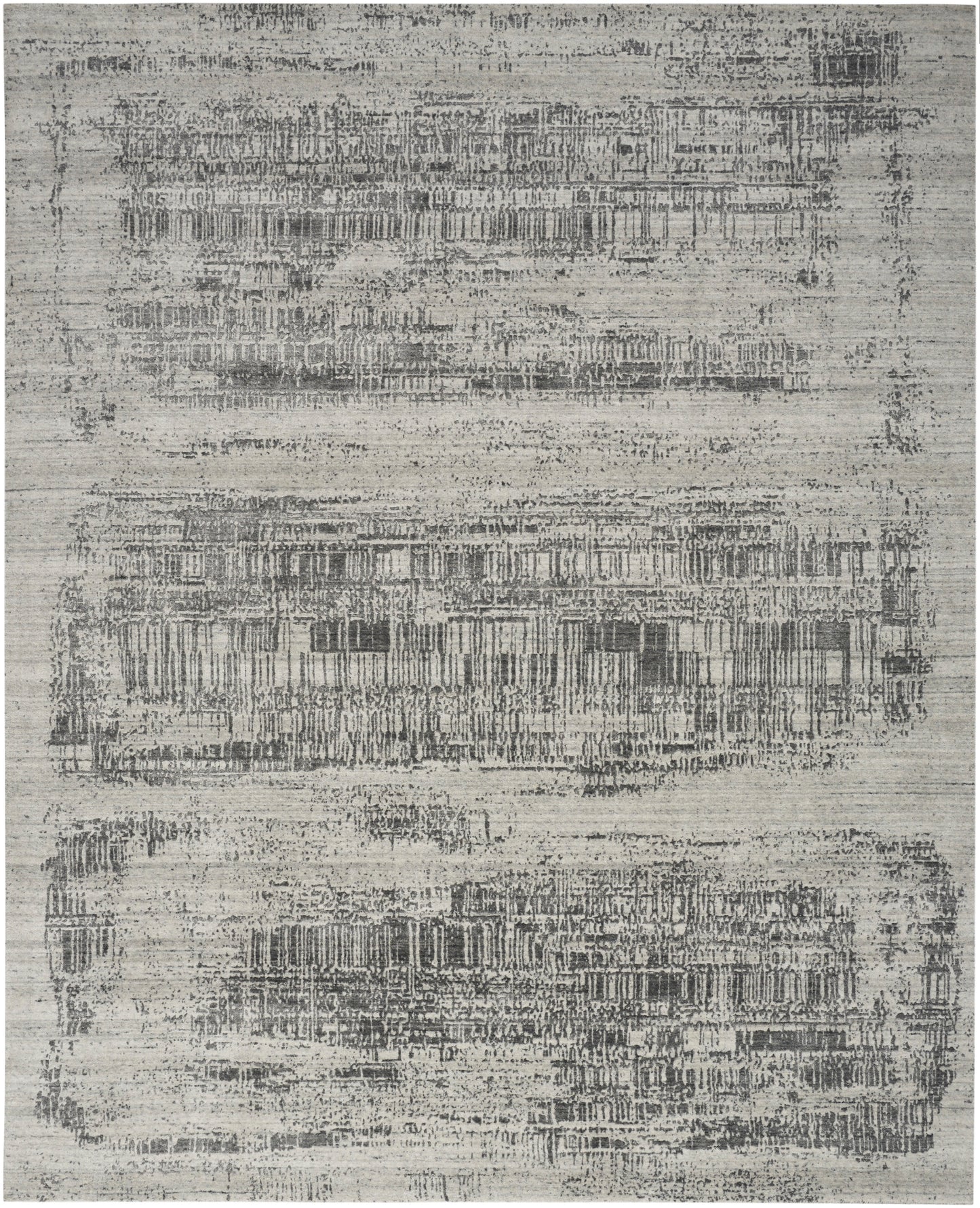 Rectangular rug in gray and ivory with distressed geometric band pattern; modern, low-pile synthetic.