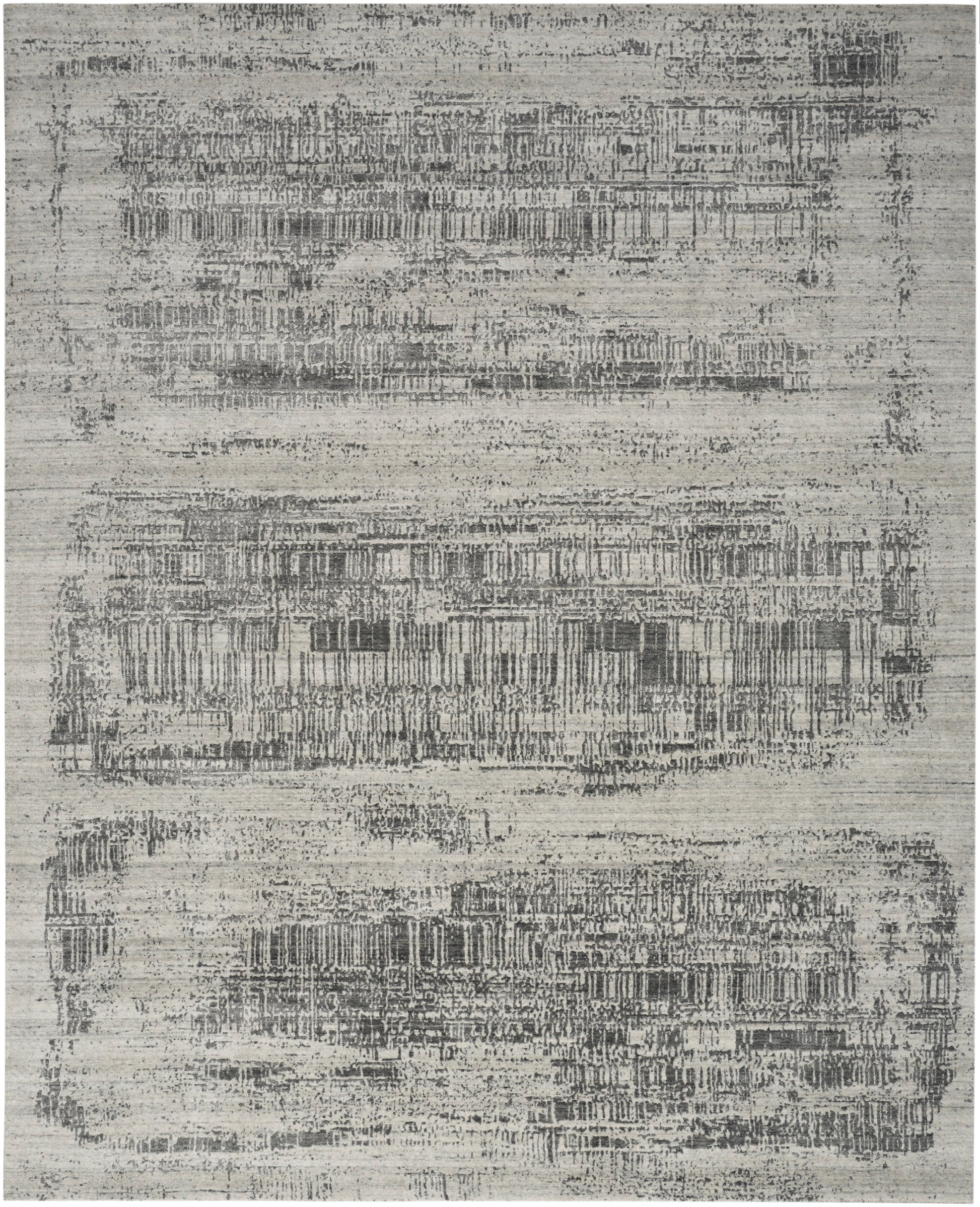 Rectangular rug in gray and ivory with distressed geometric band pattern; modern, low-pile synthetic.