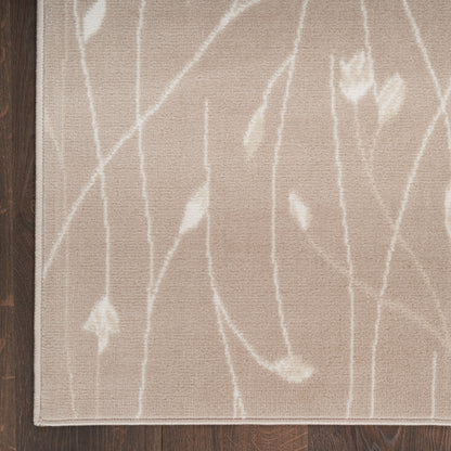 Beige runner rug with white branch-like pattern and narrow border on dark wood floor.