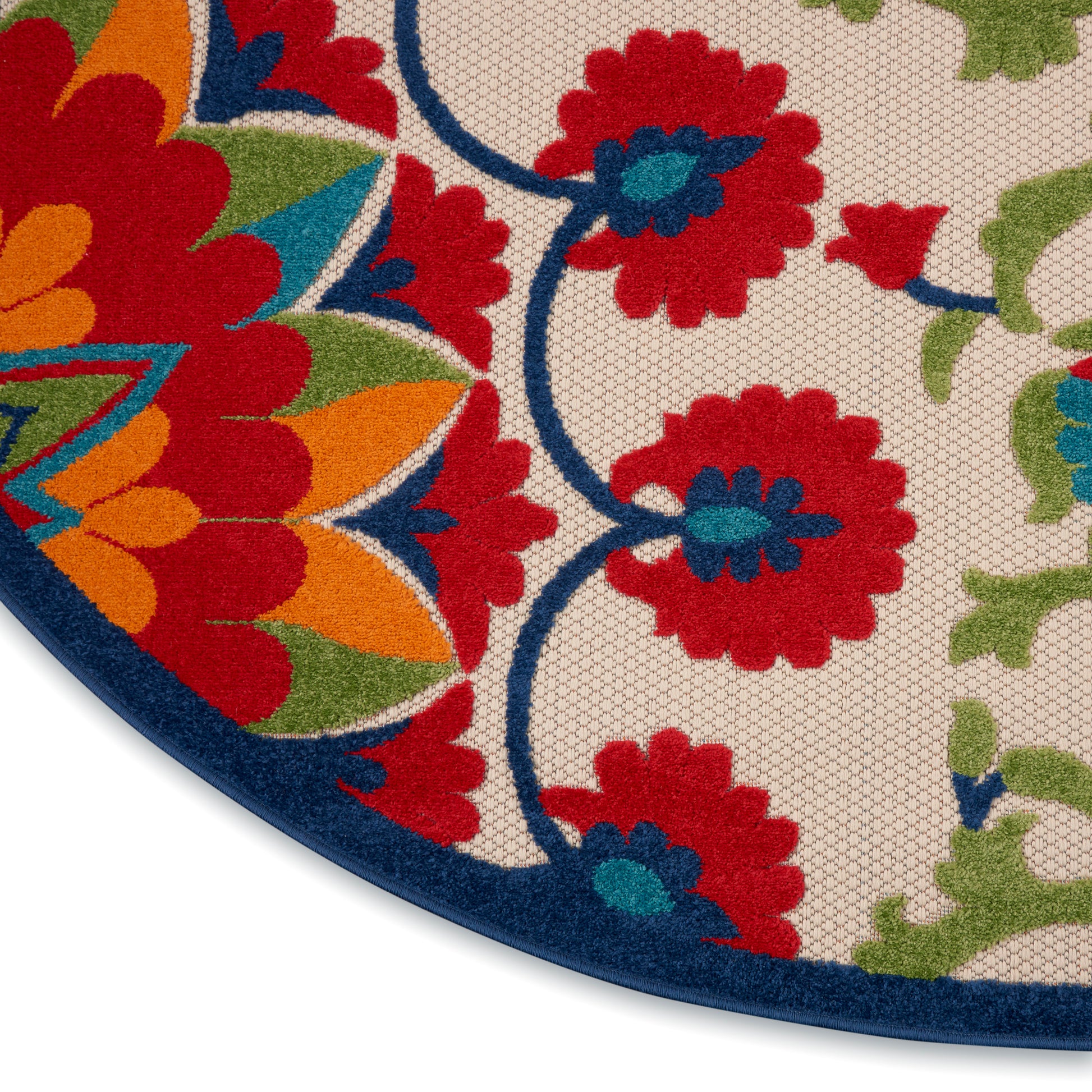 Circular decorative rug with vibrant multicolor floral pattern on beige background; blue border, red, orange, green flowers.