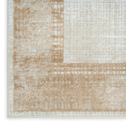 Beige and ivory distressed area rug with subtle geometric block pattern, light border, and soft low-pile texture.