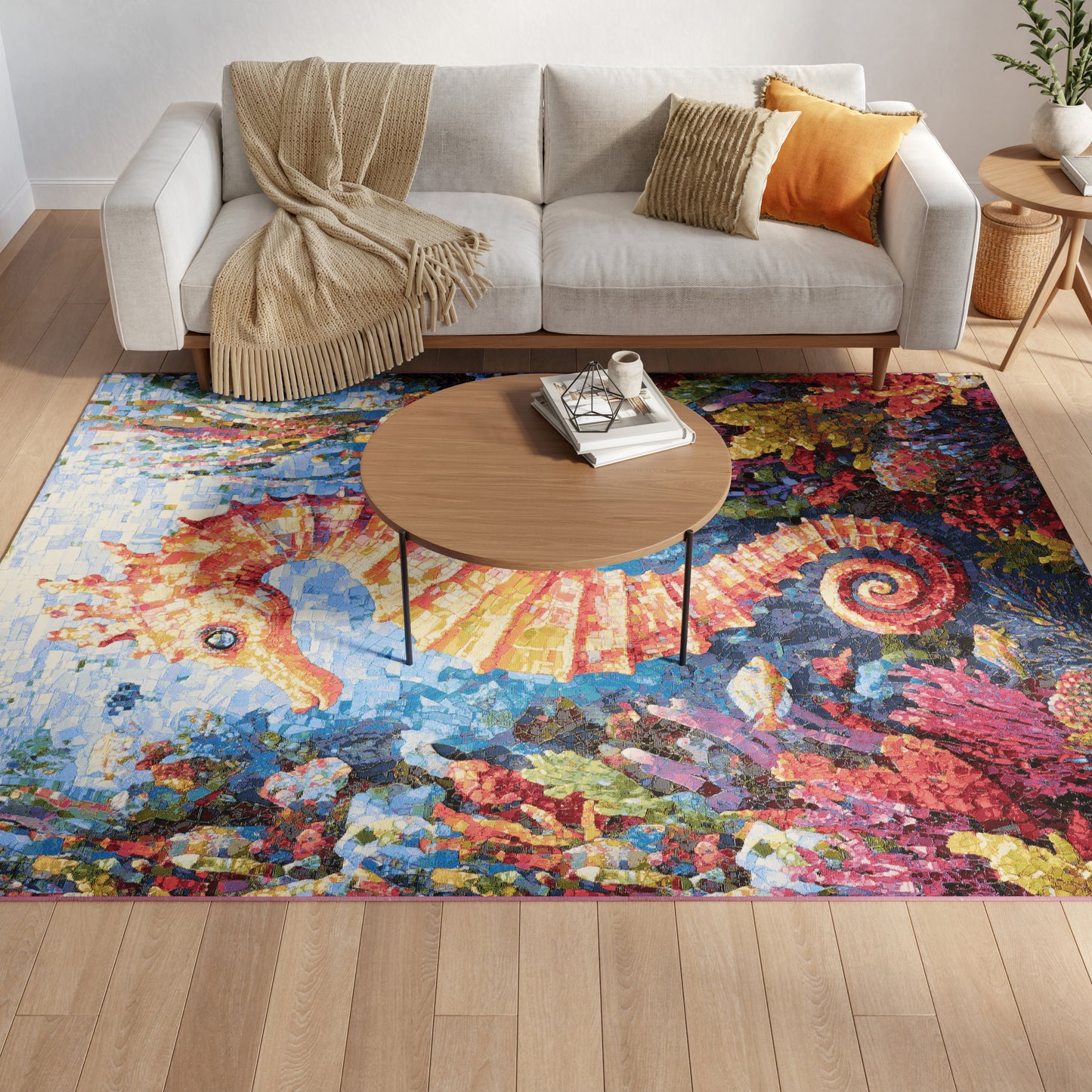 Cozy living room with light beige fabric sofa, beige knit throw, colorful abstract area rug, round wooden coffee table.