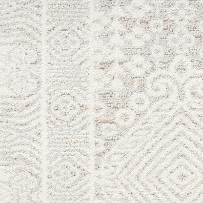 Cream textured rug with subtle geometric and damask motifs in taupe, plush pile.