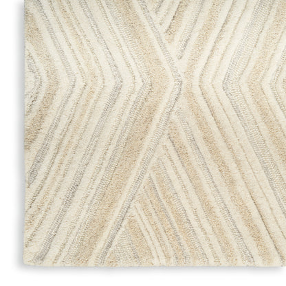 Cream and beige textured rug with raised chevron pattern and plush pile.