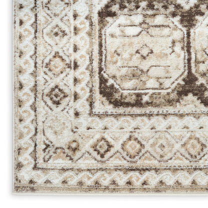 Beige and brown geometric area rug with a distressed central medallion and diamond border.