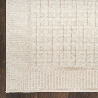 Beige woven area rug (4' x 6') with cream grid pattern and ribbed border on dark wood floor.