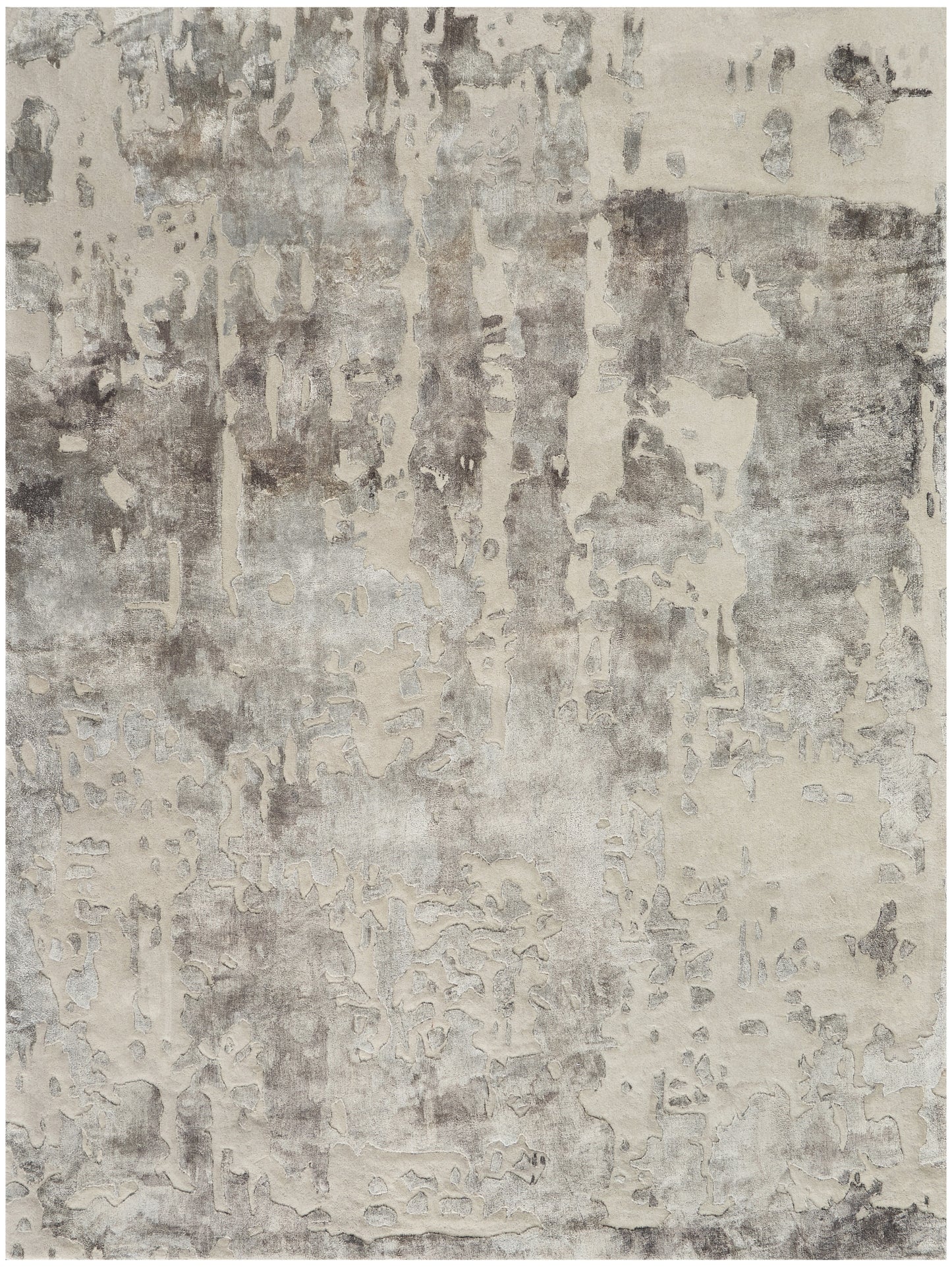 Rectangular area rug with abstract distressed beige and gray patchwork, modern style.