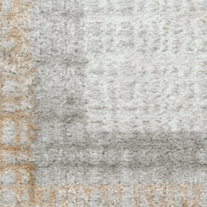 Soft gray and white shag rug with beige-tan border, plush pile and modern geometric pattern for living room.