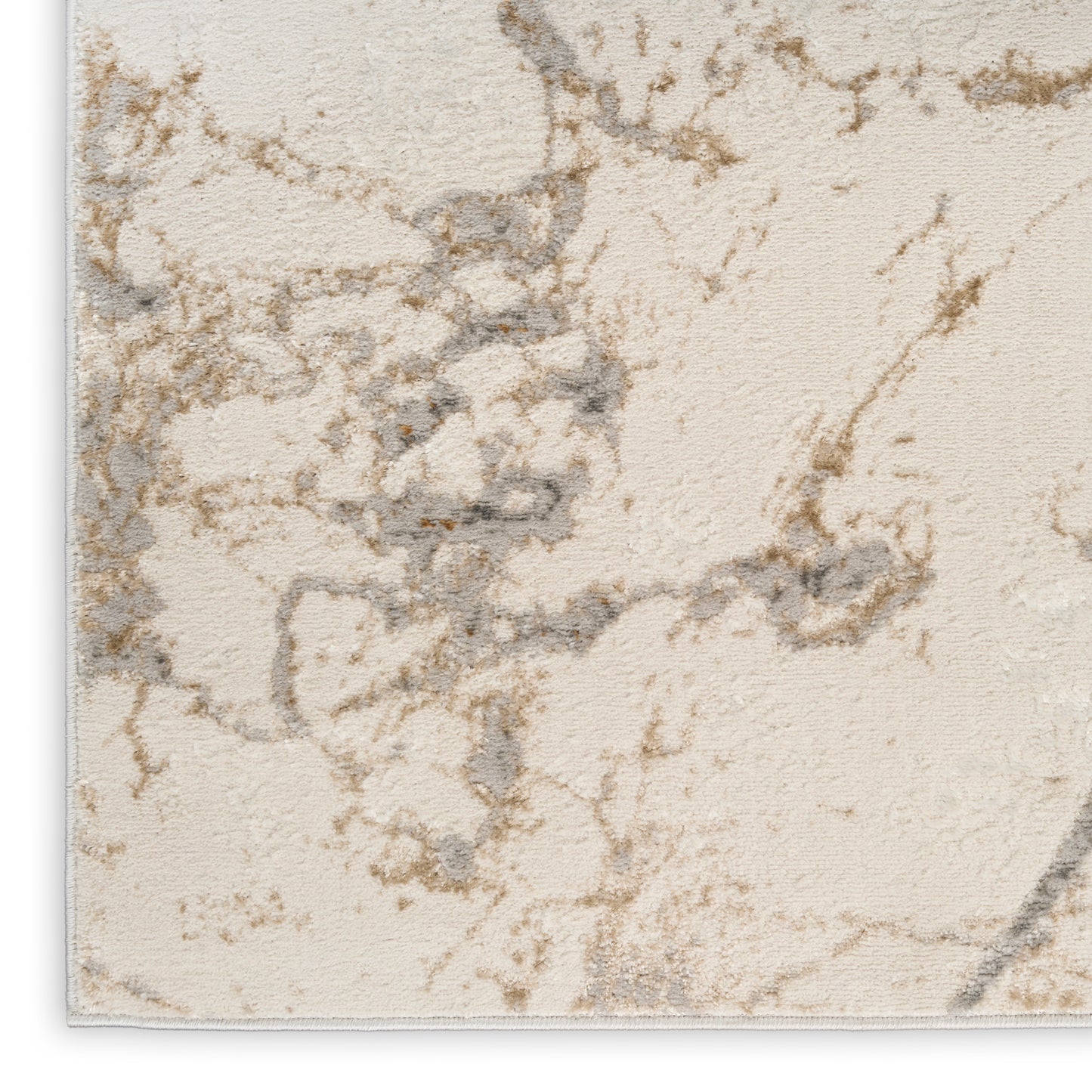 Cream-beige area rug with subtle gray-brown marble veining and soft plush pile.