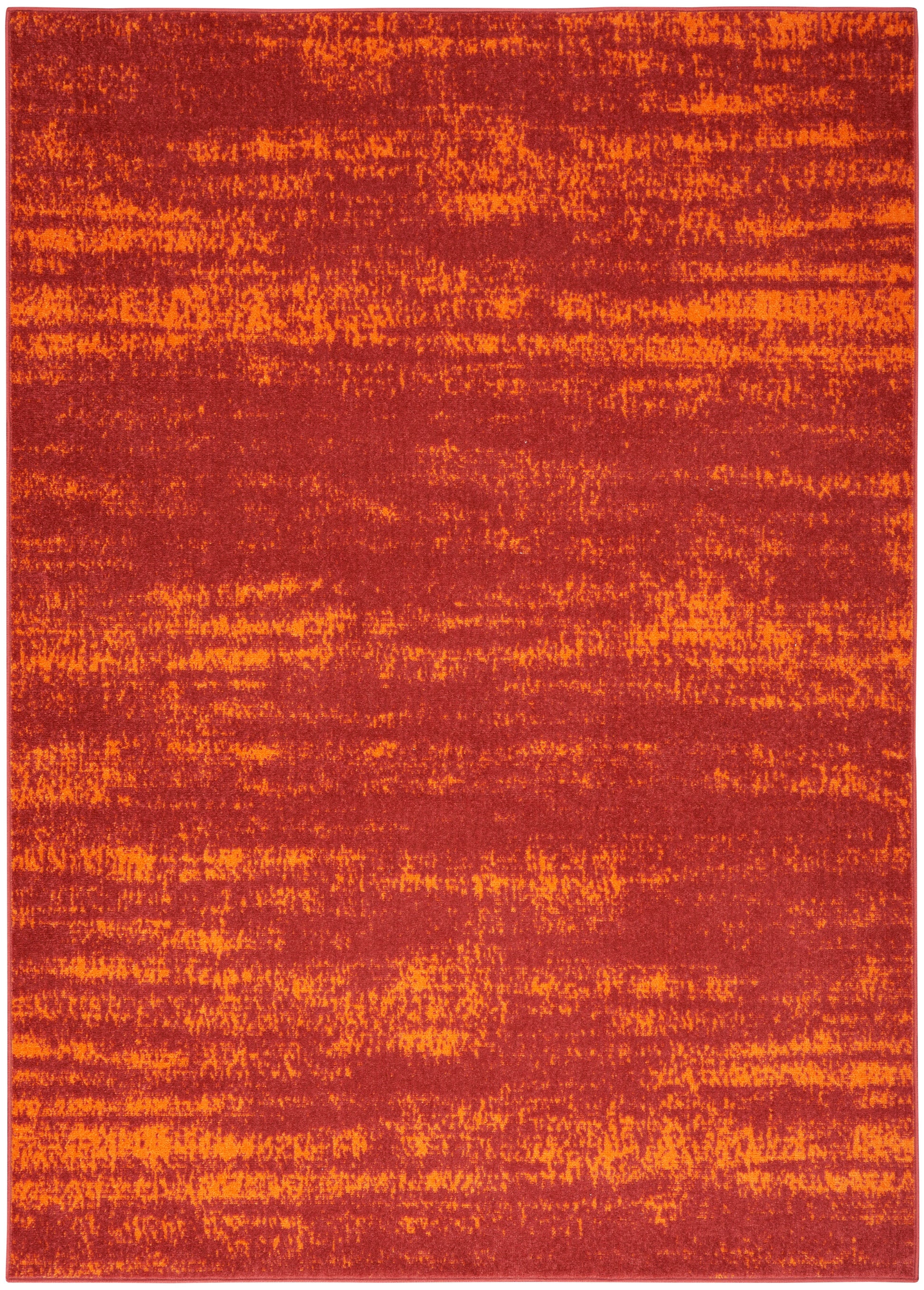 Rectangular rug in burnt orange and red hues with a textured, abstract pattern.