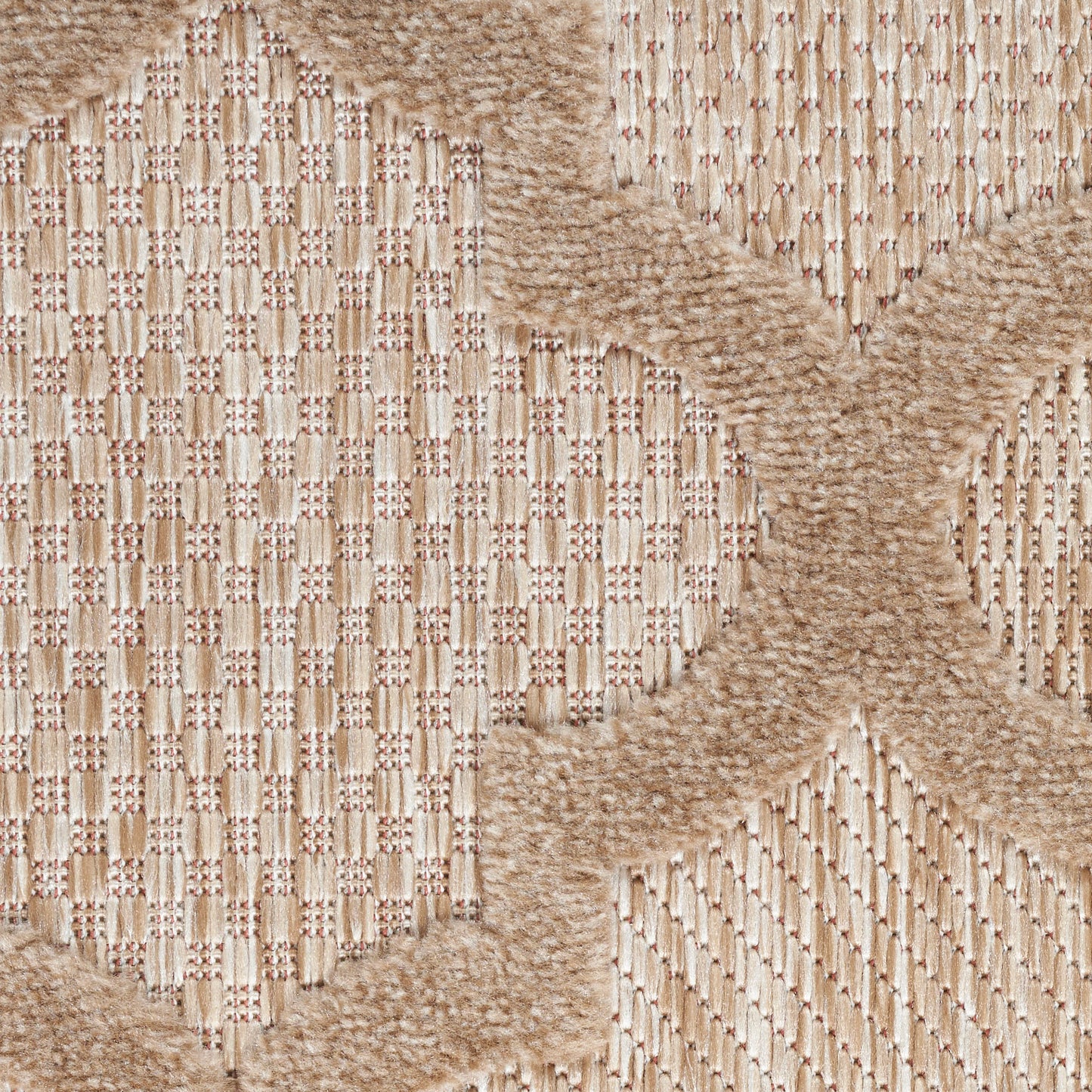 Beige trellis-pattern rug with plush tan borders; woven lattice texture in cream and tan.
