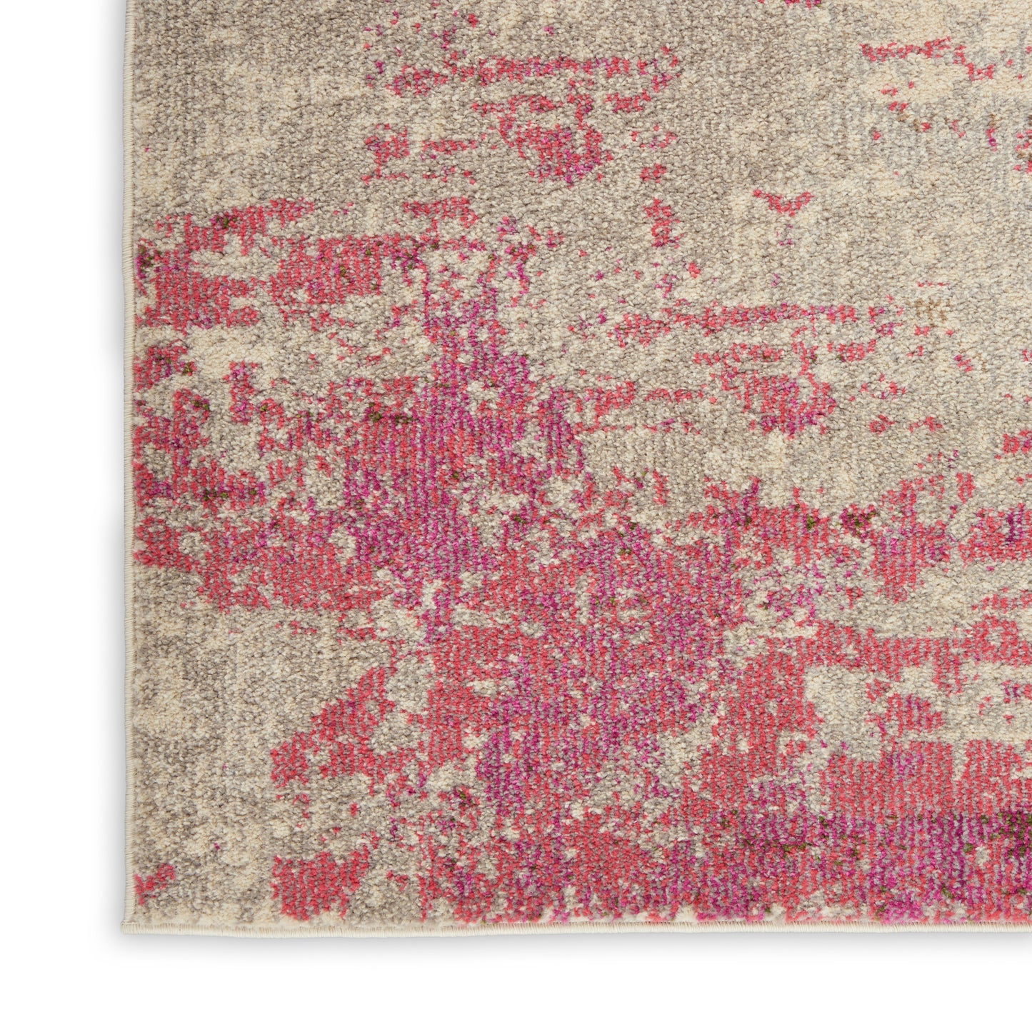 Rectangular beige rug with pink magenta abstract blotches, distressed vintage look for cozy home decor.