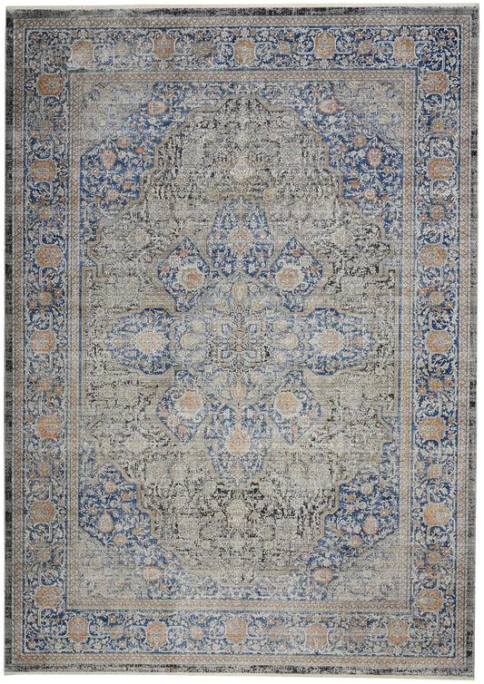 Rectangular area rug with ivory field, blue border, and peach accents; ornate Persian-style floral medallion.