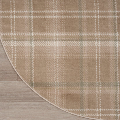 Beige plaid rug with white and sage-green stripes on light wood floor, curved edge visible.