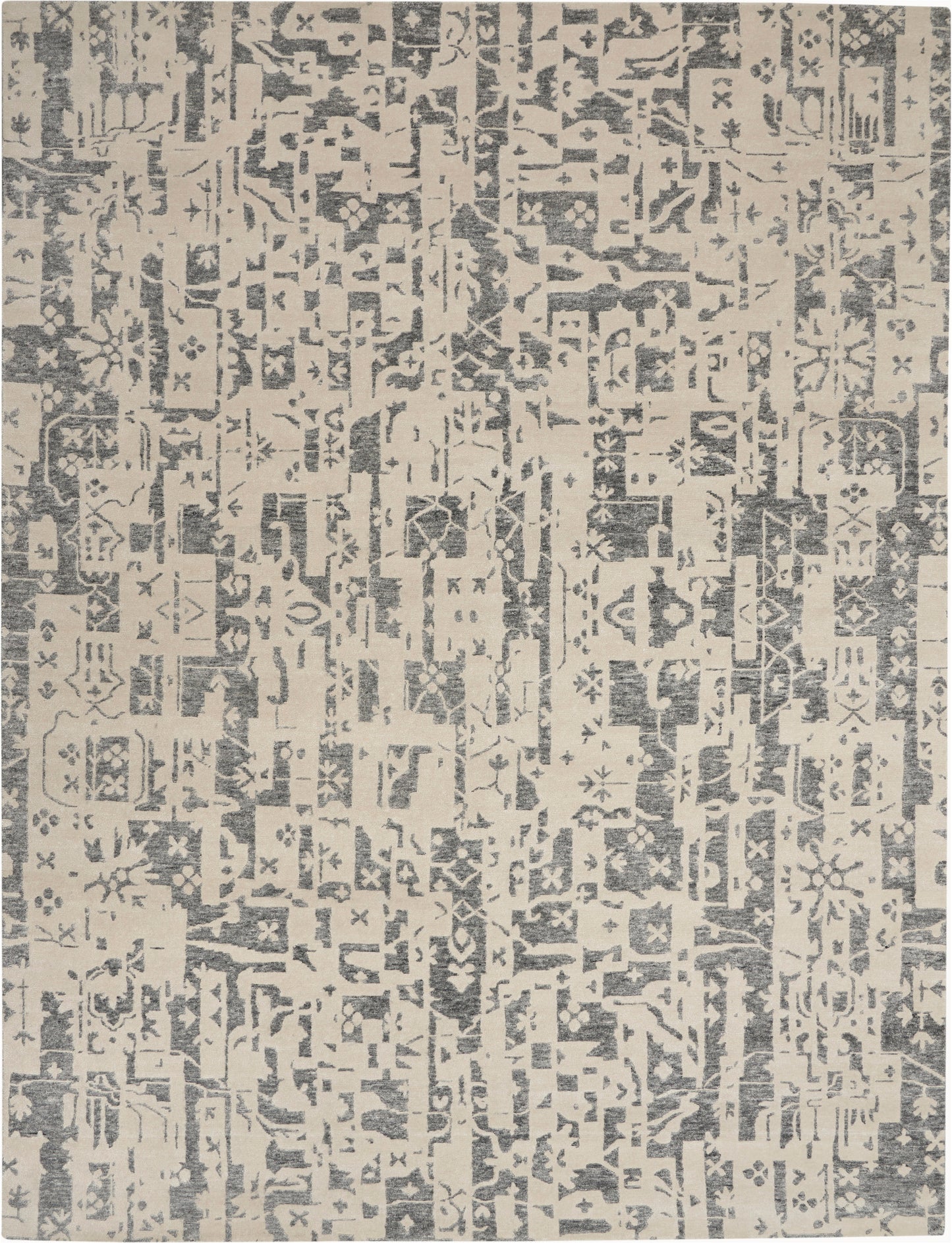 Rectangular area rug with distressed abstract geometric blocks in blue-gray on beige.