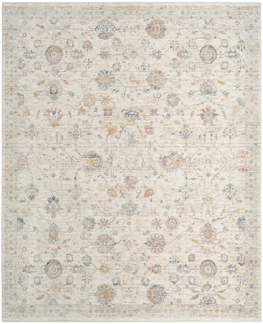 Light beige distressed oriental rug with muted blue, gold, and brown floral medallions and vines.