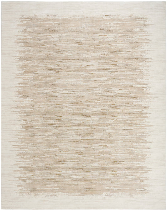 Rectangular beige rug with brushed taupe center fading to a pale border; modern, soft woven texture.