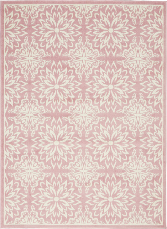 Pink area rug with repeating white floral medallions on pink background and ornate border; damask-inspired decorative rug.