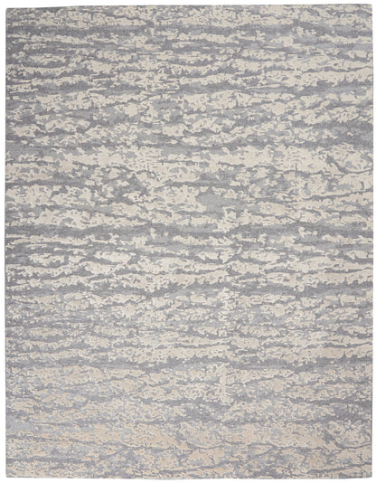 Gray and cream abstract textured rug with cloudy pattern; contemporary low-pile area rug.