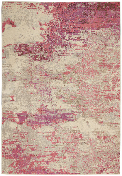 Rectangular abstract beige area rug with pink and magenta brushstroke patches; modern decorative textile.