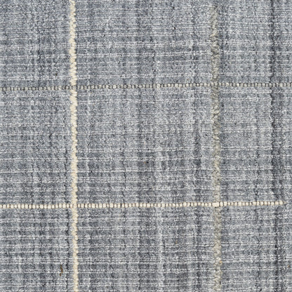 Blue-gray woven rug with beige grid lines in a plaid pattern; textured floor covering.