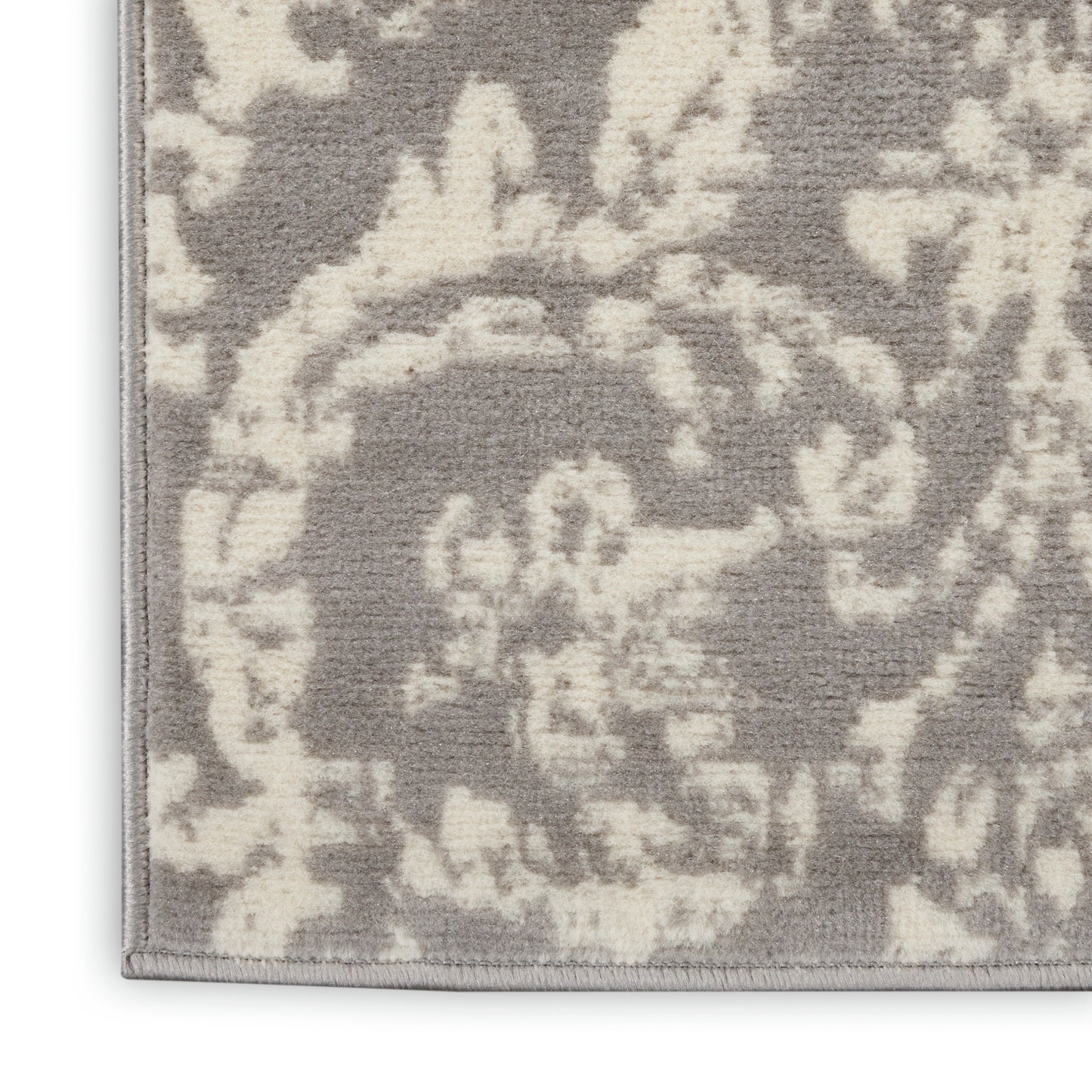 Grey and ivory damask-patterned runner rug with plush pile and bound edge, ideal living room accent.