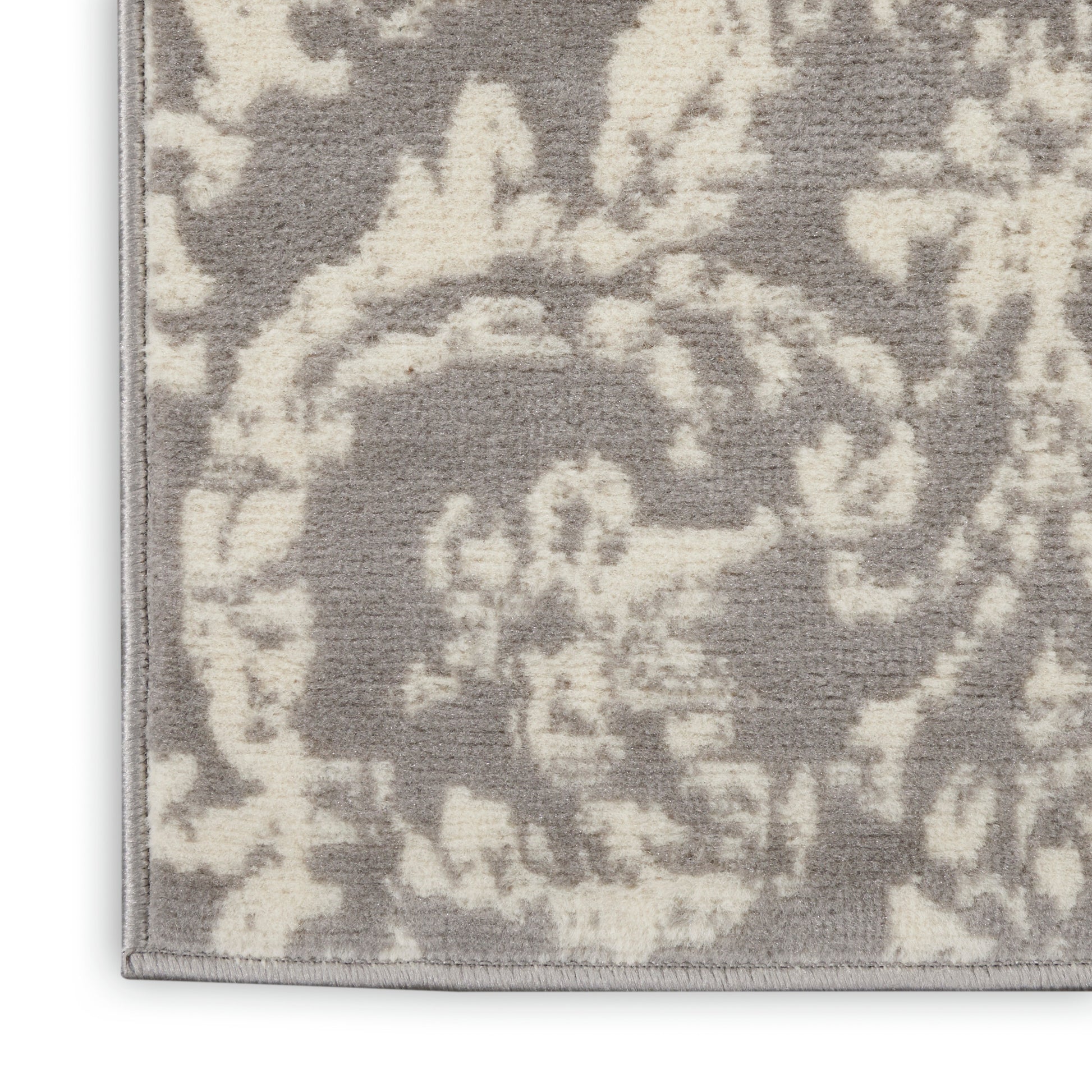Grey and ivory damask-patterned runner rug with plush pile and bound edge, ideal living room accent.