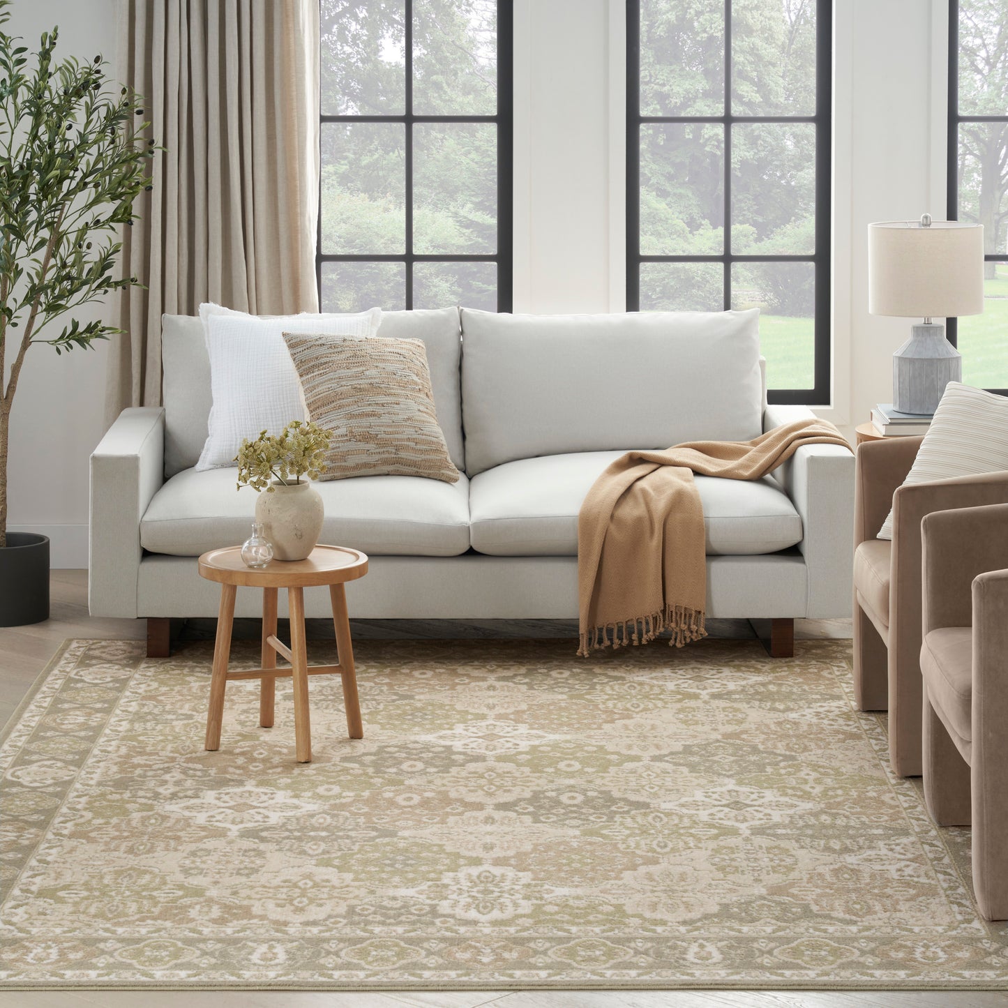 Vintage 5' x 7' rug in cream with a subtle pattern.